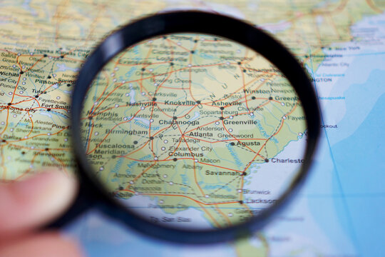 view of Atlanta, Capital city of Georgia, United States on a geographic map with a magnifying glass