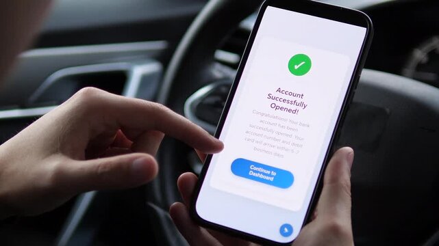 Modern financial onboarding completed anywhere. This closeup captures a driver receiving instant confirmation of a newly opened bank account directly on their smartphone. It represents the ultimate
