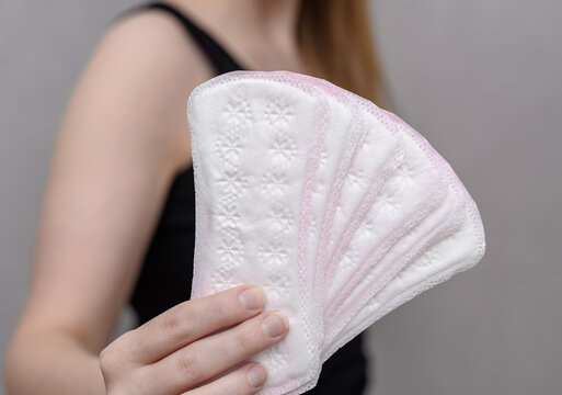 Cotton panty liners held in a woman's hand