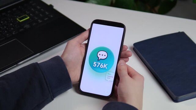 Handheld smartphone displaying rapid subscriber count increase from 547K to 600K. Professional UI concept for community management and marketing reports. Ideal for business growth, tech startups, and