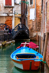 Fototapeta premium Boat At Dock Near Old House In Venice Italy