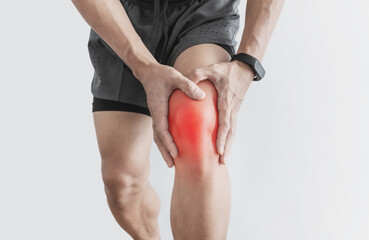Joint pain, Arthritis and tendon problems. a man touching damaged knee, isolated on white background