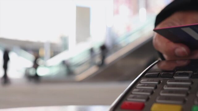 Customer making contactless payment with credit card