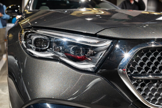 Zurich Auto Show, Switzerland, October 31, 2025. Close-up of a modern digital light headlamp of a new W215 E-Class Mercedes Benz car displayed at the Auto Zurich car show