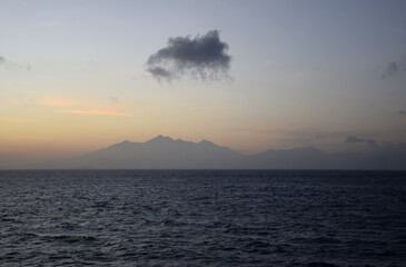 Morning atmosphere with a beautiful, clear sky from a distant mountain amidst the vast expanse of sea.