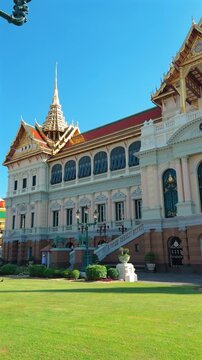 A majestic view of the Ananta Samakhom Throne Hall in Bangkok, Thailand, showcasing its grandeur and intricate design under a clear blue sky