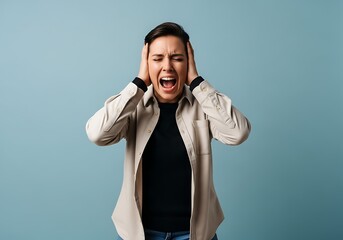 Woman screaming and covering ears in frustration
