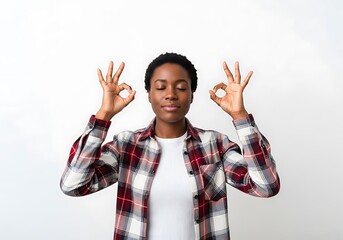 Woman meditating with eyes closed and hands in mudra gesture