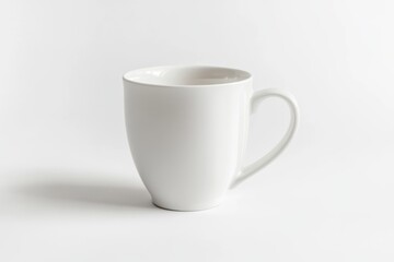 Obraz premium Classic white ceramic coffee mug isolated on white background with soft shadow. Minimalist mockup for branding or design