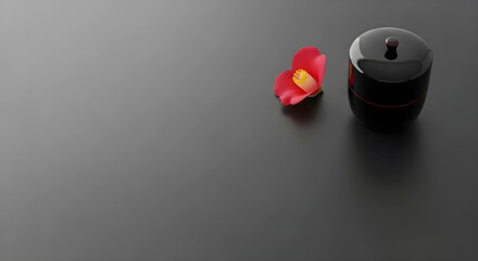 茶道具の棗と花びらのシックな和風背景。消炭色の背景に右上の格式高い装飾。高級旅館やブランド向けのデザイン余白。