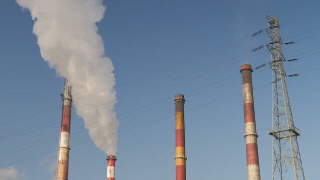 Air pollution. Smoking chimney of a coal power plant