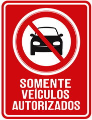 A red sign in Portuguese warns that vehicle entry is prohibited, except for authorized vehicles. Authorized vehicles only
