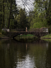 Woman Standing on Bridge in Łazienki Park, Warsaw