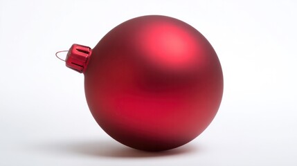 Studio close-up of red holiday ball ornament isolated on white, expressing festive cheer and elegant simplicity. cultural branding, event materials.