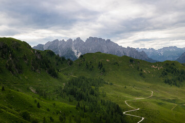 Obraz premium Panoramic view of alpine peaks during the summer season. Unspoiled nature.