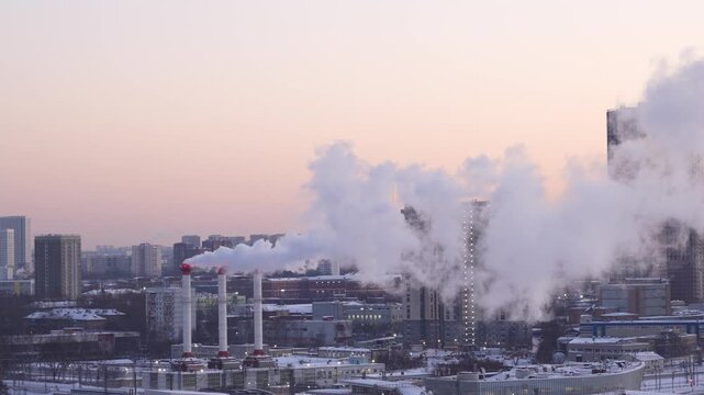Winter city skyline with industrial smoke and steam rising over residential buildings, symbolizing air pollution, heating systems, environmental impact, and urban life in cold season