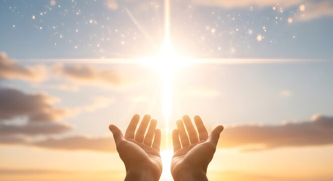 Outstretched hands welcoming the radiant sunrise