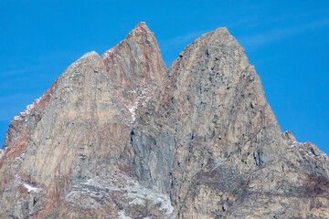 Three peaks of Uummannaq Mountain on Uummannaq Island in the Uummannaq Fjord, in Greenland, with blue skies in early September, 2025. 