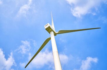 Wind power generation under blue sky and white clouds