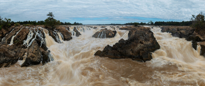 Panoramic view of turbulent cascades and rocky islands at Khone Phapheng Waterfall.