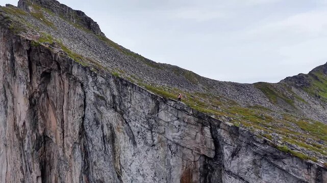 Majestic seaside cliff with sweeping horizon and breeze. Rugged oceanfront cliff with expansive vista and gusty ambiance