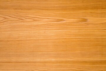 Obraz premium Natural warm golden oak wood plank texture seamless background with horizontal straight grain and subtle natural knots in rich honey tones