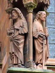 Obraz premium Zoomed detailed view of Gothic statues on the west portal of Freiburg Minster, Germany, part of a medieval sculptural program depicting biblical scenes as a visual Bible for the illiterate, Feb. 2011