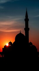 Silhouette of mosque at sunset sky.