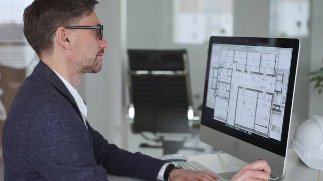 Architect developing building blueprint on computer, engineering and urban planning a new construction project. Business and architecture concept