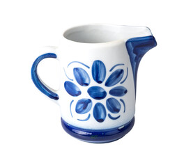 White and blue decorated ceramic milk pitcher isolated over white background