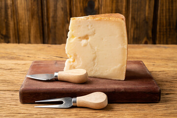 Parmesan cheese over wooden table
