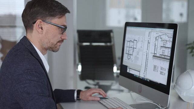 Architect developing building blueprint on computer, engineering and urban planning a new construction project. Business and architecture concept