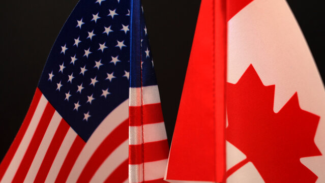 United states and canada flags side by side