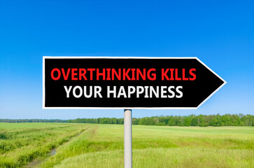 Overthinking kills your happiness symbol. Concept words Overthinking kills your happiness on black road sign. Beautiful blue sky background. Business overthinking kills happiness concept. Copy space.