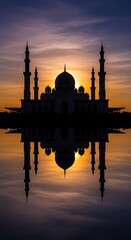 Naklejka premium Silhouette of mosque at sunset reflection.