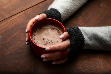 Cozy Self-Care Moment with Hands Holding Warm Coffee Mug
