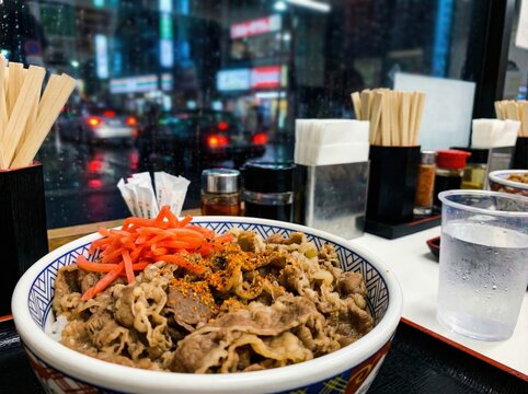 Gyudon Beef Bowl with Red Ginger in Japanese Restaurant Atmosphere