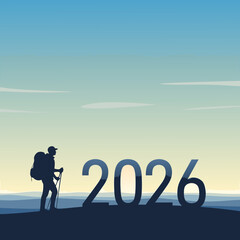 Hiker standing on hill with 2026 numbers at sunset