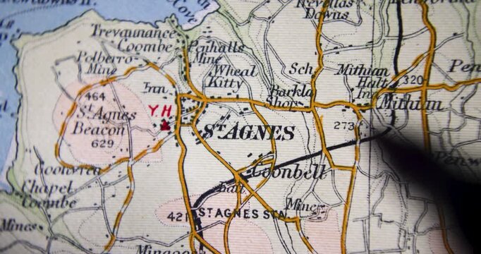 Footage of an old historical map from 1900 showing the city of St Agnes which is a civil parish and town on the north coast of Cornwall with a pan circling the city with a black marker
