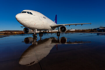 Midnight Freight: Cargo Jet Poised for Departure on Rain-Soaked Runway
