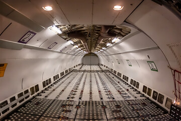 Midnight Freight: Cargo Jet Poised for Departure on Rain-Soaked Runway