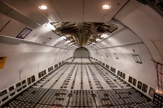 Midnight Freight: Cargo Jet Poised for Departure on Rain-Soaked Runway