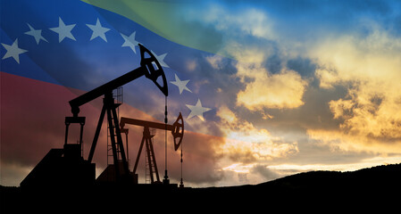 The change in oil prices. Oil price cap concept. Oil drilling derricks at desert oilfield with Venezuela flag.