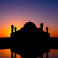 Silhouette of mosque at sunset.