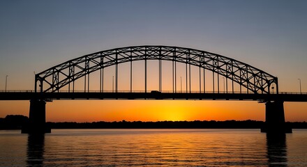 Obraz premium Sunset over a steel bridge water.