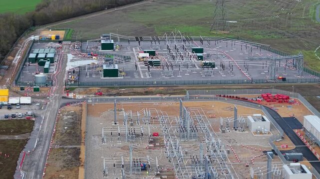 Aerial view of the Biggleswade National Grid 400/132kV Substation, a sprawling complex of electrical equipment and infrastructure, Biggleswade, United Kingdom.