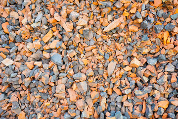 scattered rough fragments of broken brick and stone aggregate