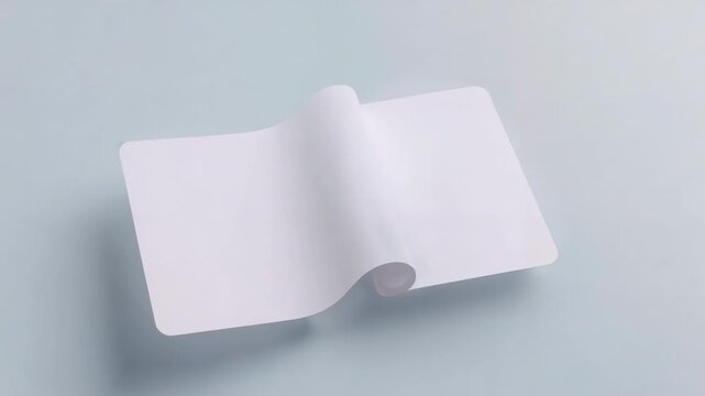 Showing white sheet forming central curl and shifting right on pale blue tabletop after subtle lift