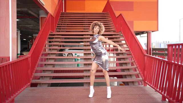 A Fashion Model Elegantly Posing on a Vibrant and Colorful Staircase in the City