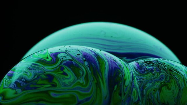 Vibrant swirling patterns on soap bubbles